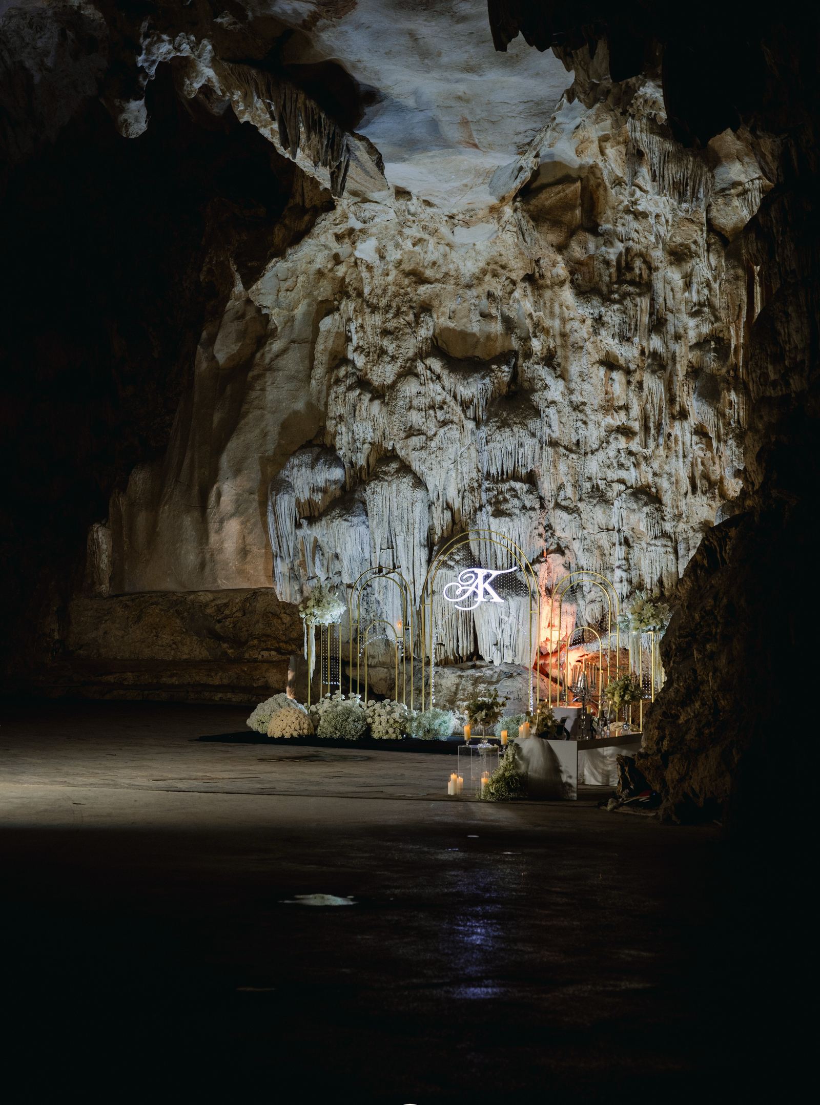A ceremony setting against the flowstone. The cave gives couples a backdrop that needs no additional styling.